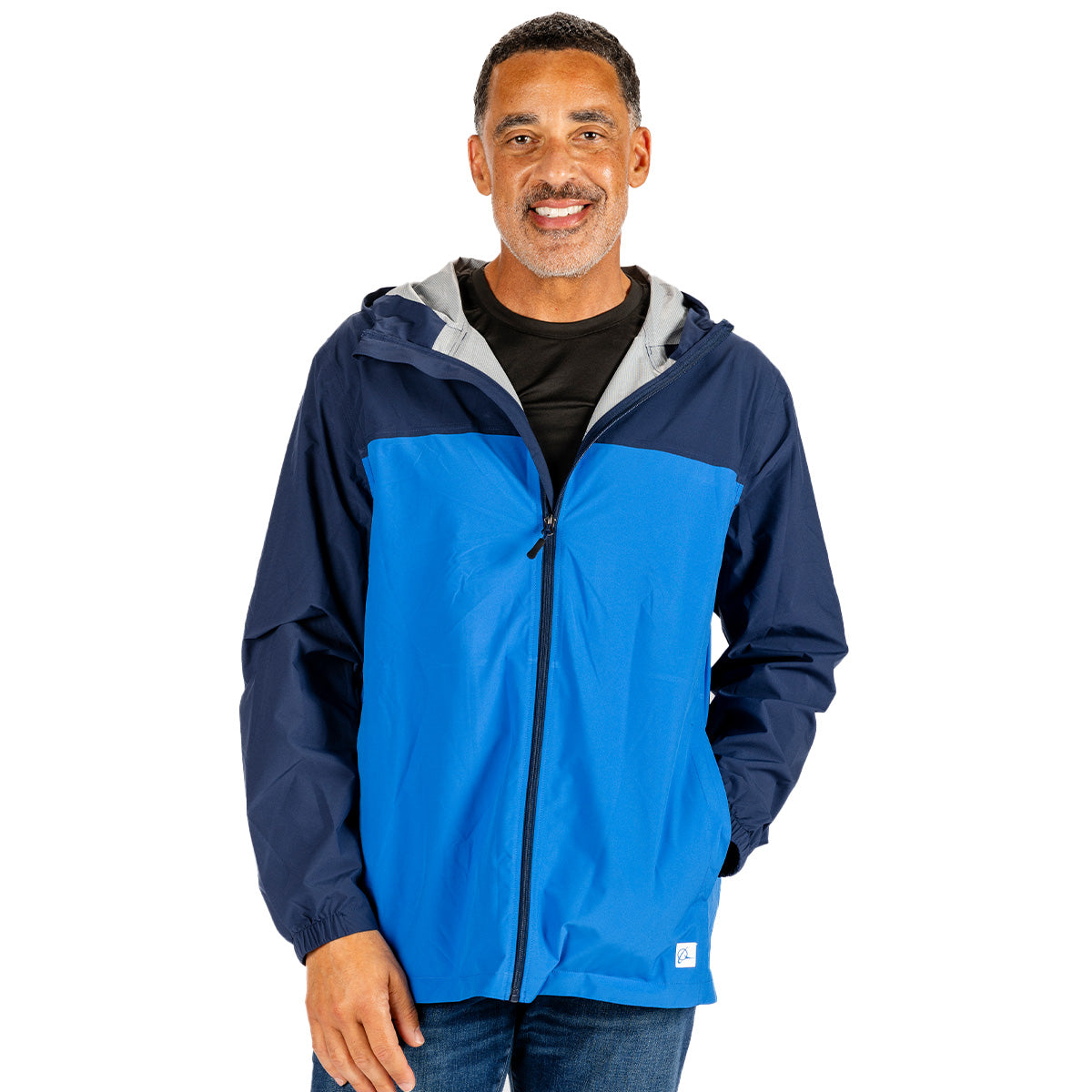 A man wearing a lightweight, two-toned navy and blue Boeing Unisex Waterproof Rain Jacket with a gray lining.