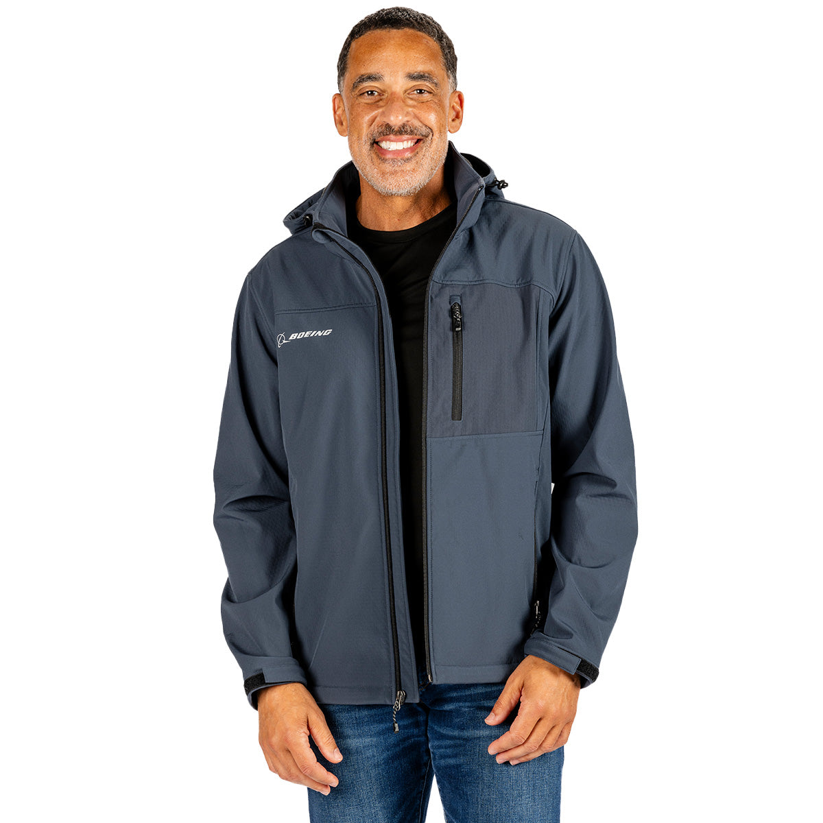 A man wearing a dark blue, weather-resistant Boeing Unisex Softshell Hooded Jacket featuring a zip-up front, a chest pocket, and a small Boeing logo on the right side.