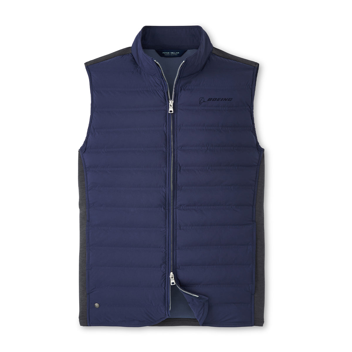 The Peter Millar Boeing Men’s Winsome Hybrid Vest features a navy blue, sleeveless design with gray side panels, front zipper, and BOEING logo on the left chest. The vest is displayed flat against a white background.