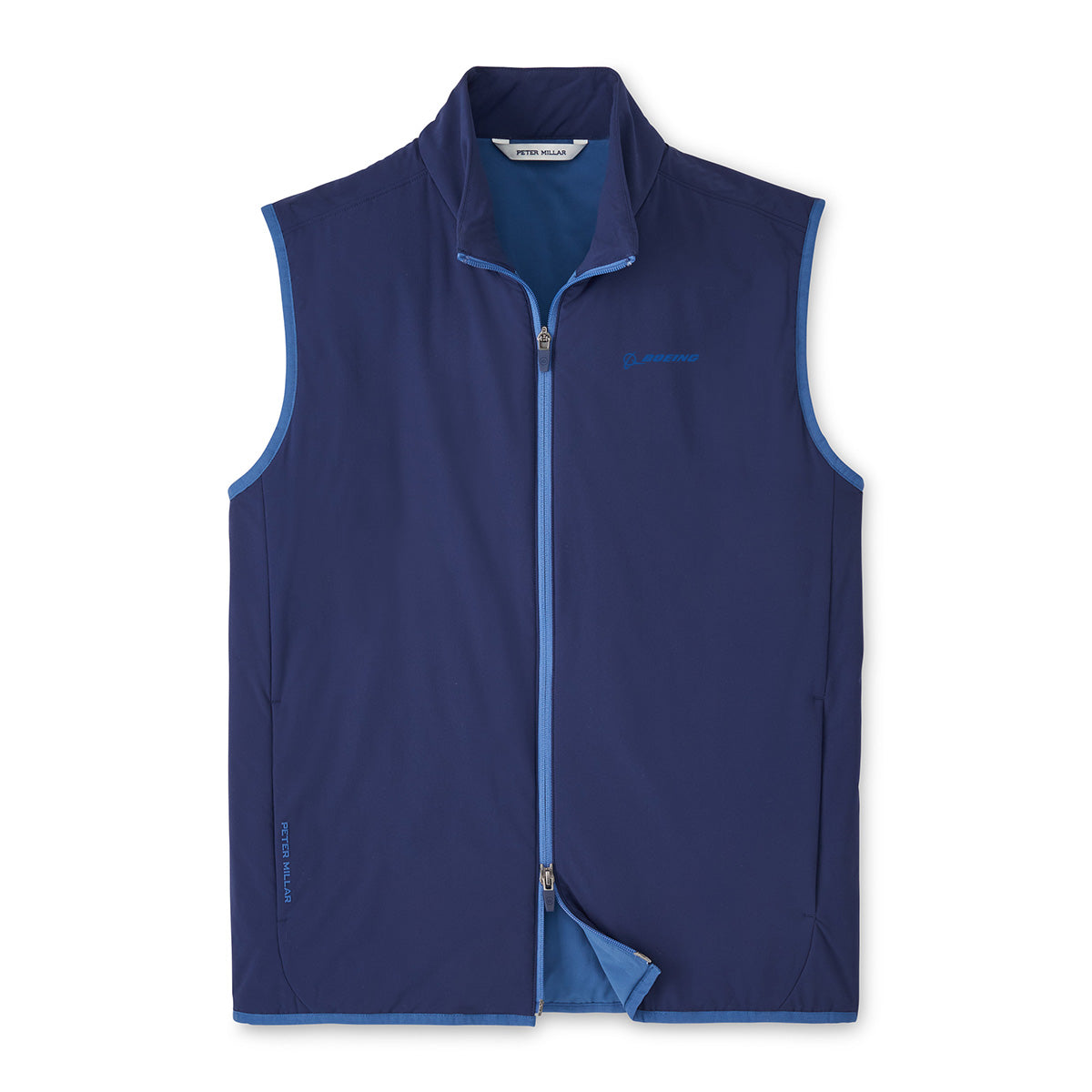The Peter Millar Boeing Men’s Ridge Vest by BOEING is a sleeveless, zip-up navy blue vest with light blue lining and trim, a small chest logo, and side pocket zippers. This lightweight insulated vest is shown on a white background.
