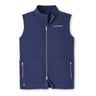 The Peter Millar Boeing Men’s Contour Performance Vest by BOEING is a sleeveless, ultra-lightweight navy blue vest featuring an upright collar, smooth four-way stretch material, a front zipper, two zippered pockets, and the Boeing logo on the left chest.