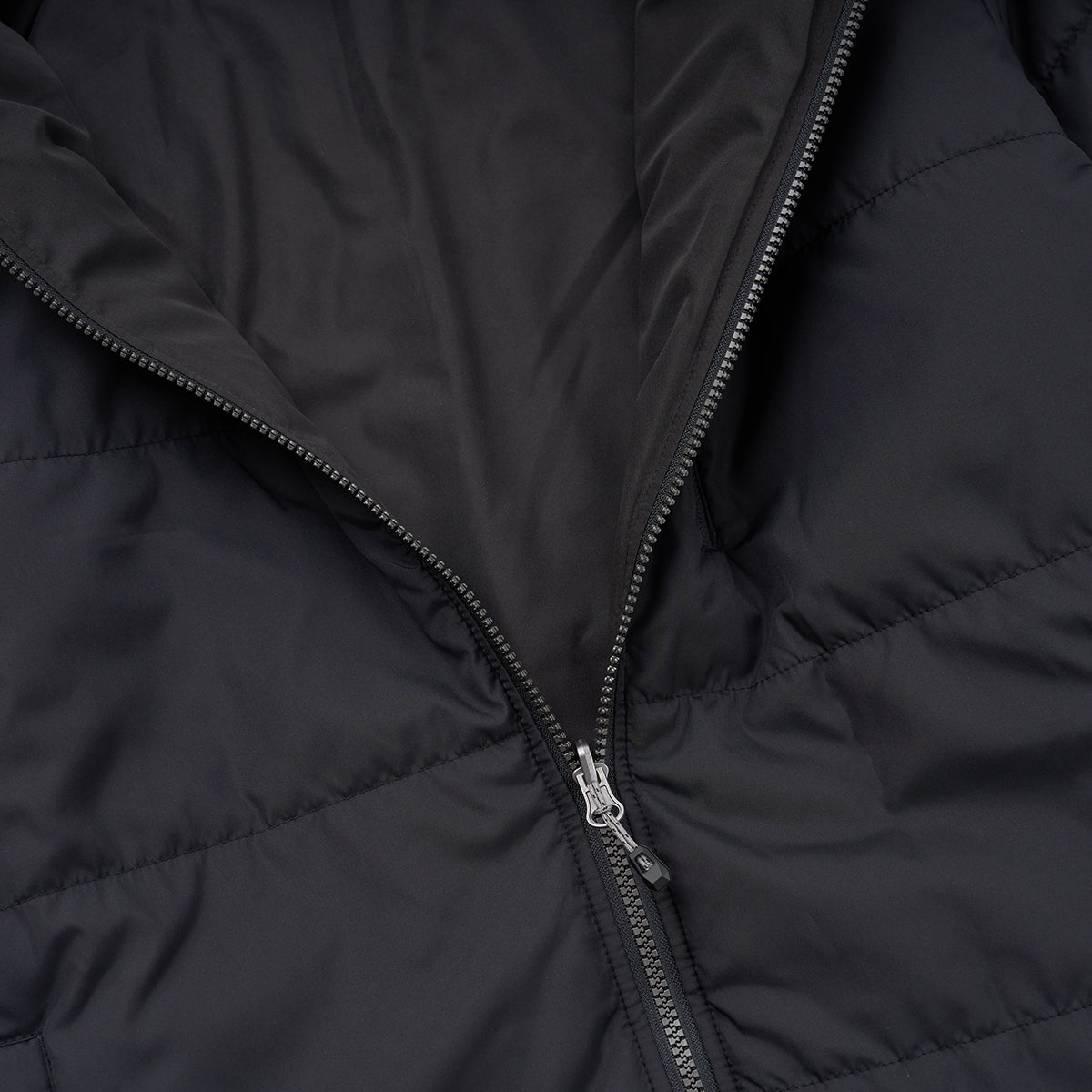 Close-up of the Boeing Men's 3-in-1 Systems Jacket by BOEING, featuring a partially unzipped front to reveal its inner lining and stitching—perfect for those seeking versatile outerwear and dependable weather protection.