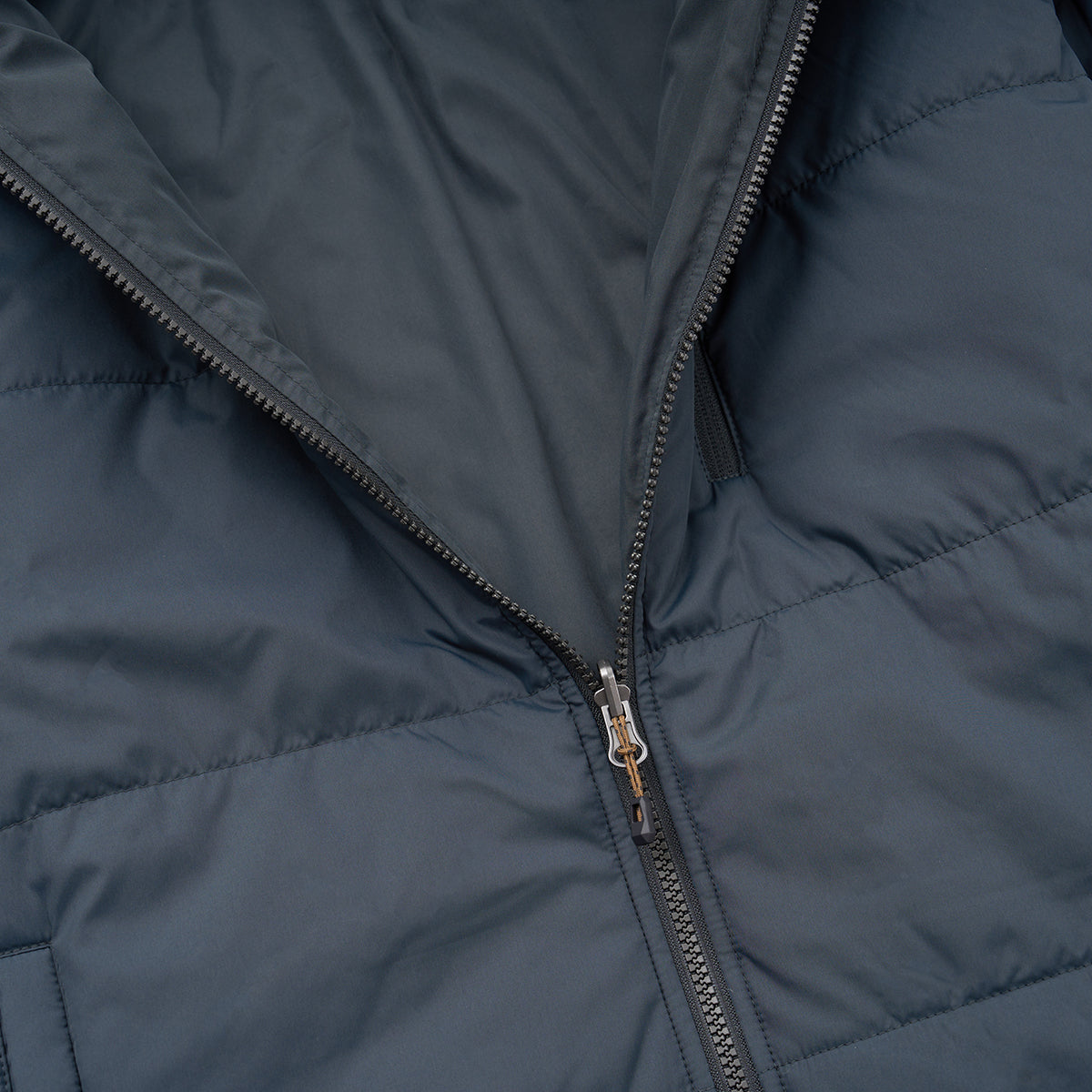 Close-up of the BOEING Men's 3-in-1 Systems Jacket in dark blue, featuring a partially unzipped zipper that reveals its smooth inner lining and quilted outer shell—ideal for versatile weather protection.