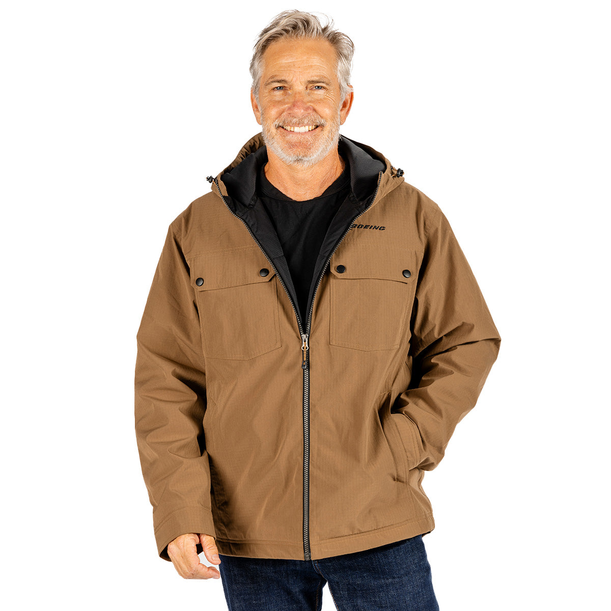 A smiling man wears a tan Boeing Men’s Ripstop Jacket with a black interior lining and chest pockets.