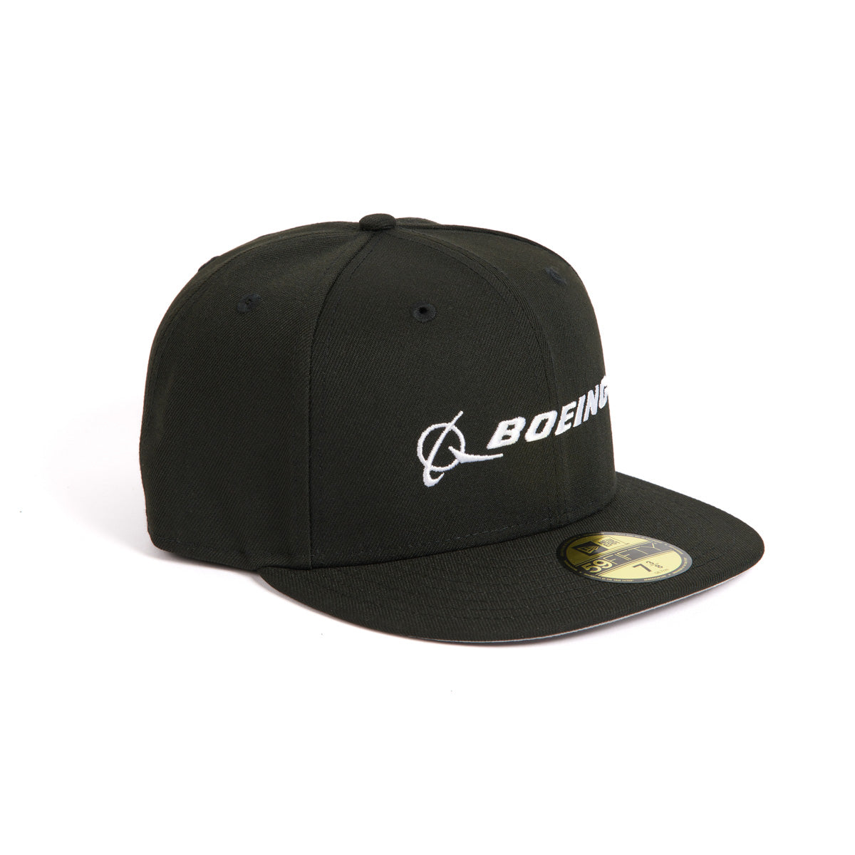 The New Era 59FIFTY Boeing Signature Logo Hat from The Boeing Store is a black fitted cap with a white embroidered Boeing logo on the front, featuring a flat brim and a gold size sticker, all set against a pristine white background.