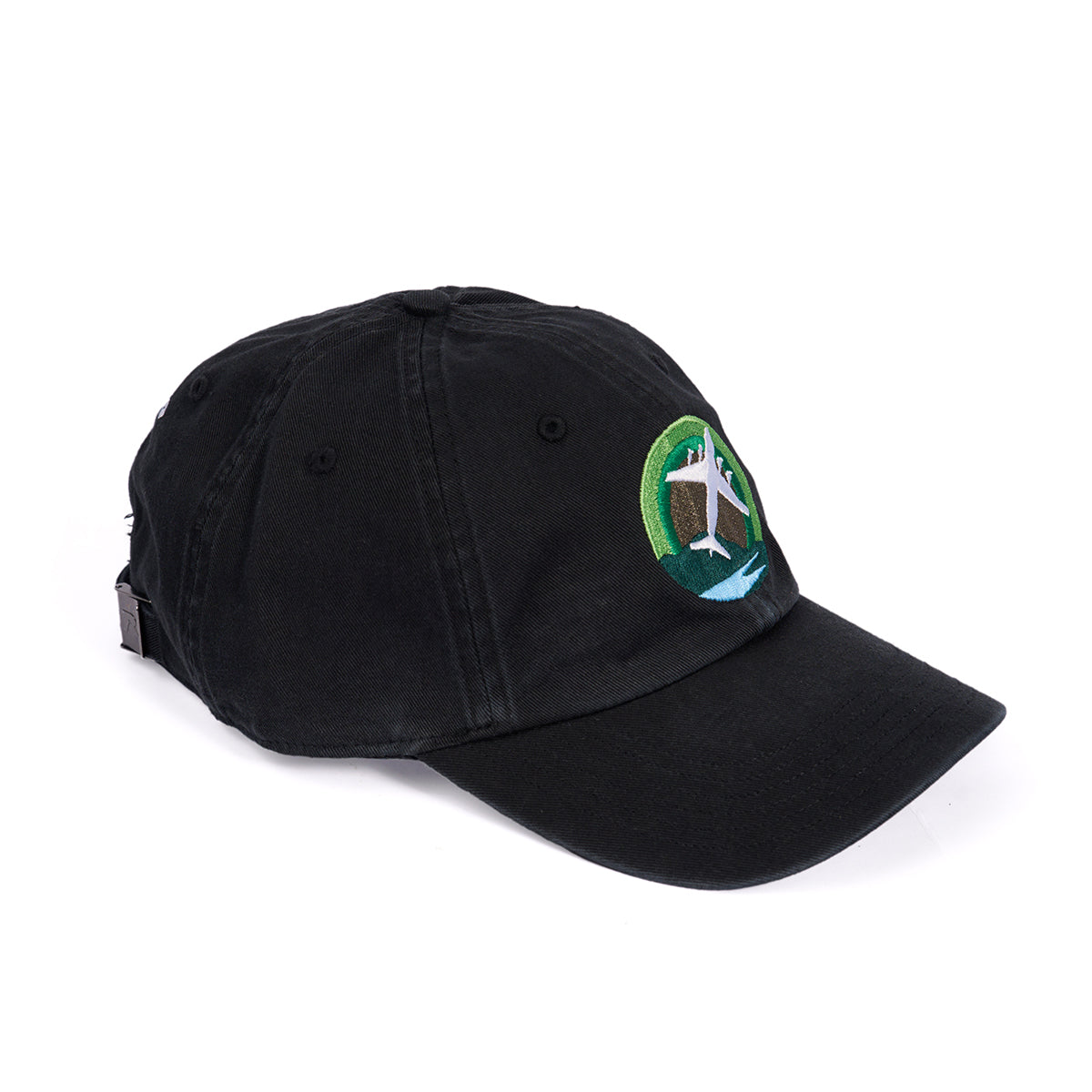 The Boeing C-17 Globemaster Skyward Hat by Boeing is black, with an embroidered circular patch on the front featuring a green, blue, and white standing deer design. It has a curved brim and adjustable backstrap for comfort.