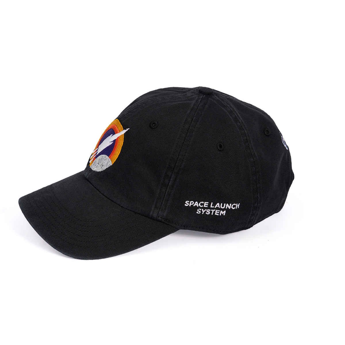 The Boeing Space Launch System Skyward Hat is a black cap with an embroidered space-themed logo on the front and Boeing Space Launch System in white on the side. It features an adjustable cloth backstrap and is showcased against a plain white background.