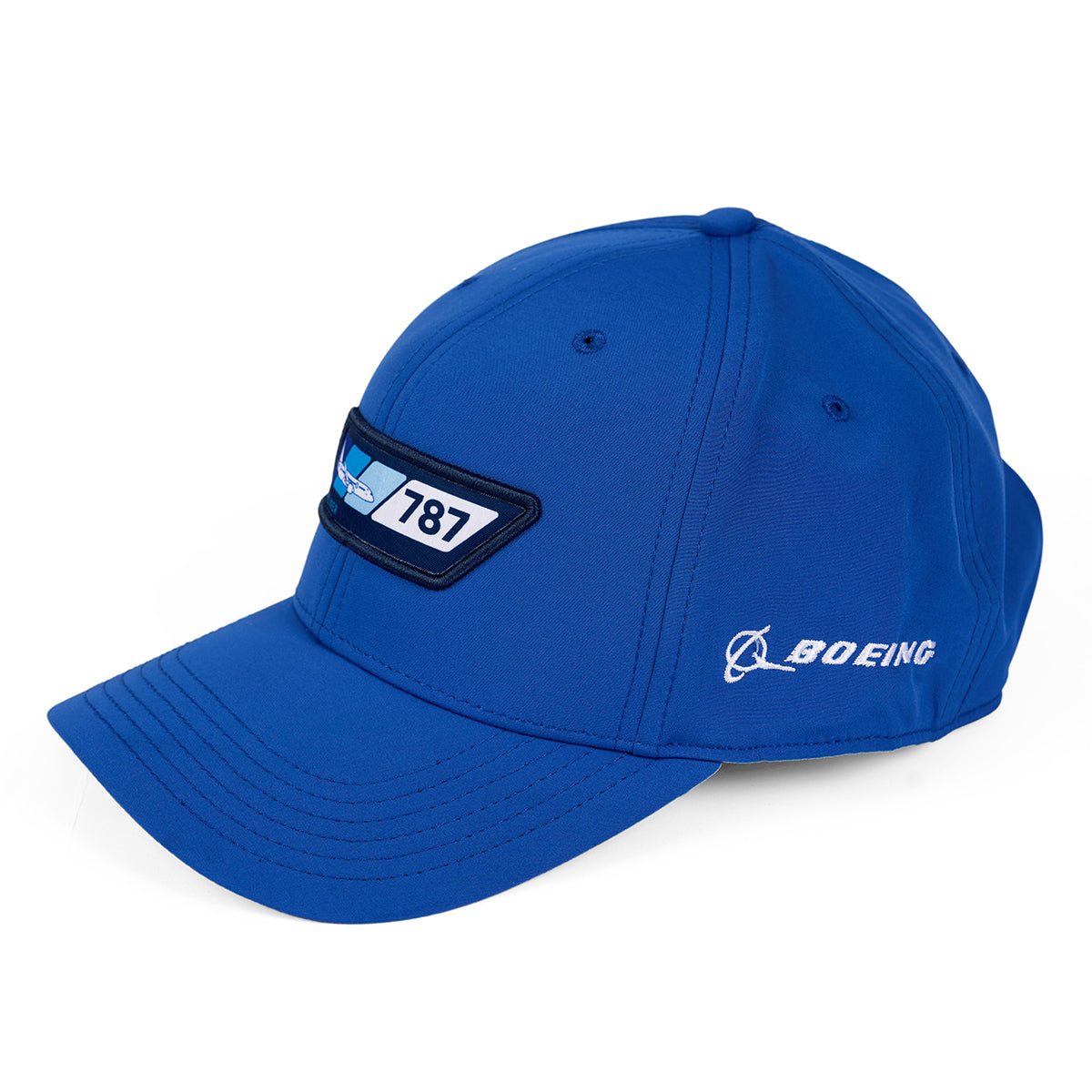 The Boeing 787 Dreamliner Velocity Unisex Hat is a blue cap with an embroidered 787 logo on the front and Boeing on the side. It features an adjustable velcro closure, curved brim, moisture-wicking fabric, and stitched eyelets for ventilation—ideal for Boeing 787 enthusiasts.