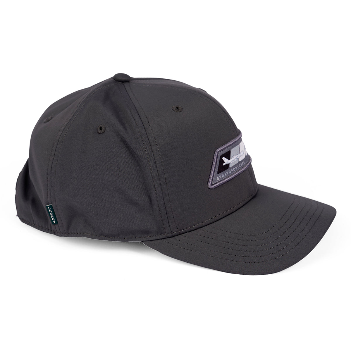 The Boeing B-52 Velocity Unisex Hat in dark gray includes a black adjustable strap, an embroidered front patch, and a small green side tag. With a unique neck-protecting flap and moisture-wicking fabric, its perfect for long outdoor days.