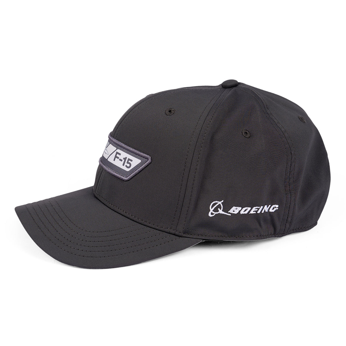 The Boeing F-15 Eagle Velocity Unisex Hat features embroidered designs, a moisture-wicking fabric, and an adjustable Velcro closure. A patch with F-15 adorns the left side, while the right displays the Boeing name and logo.