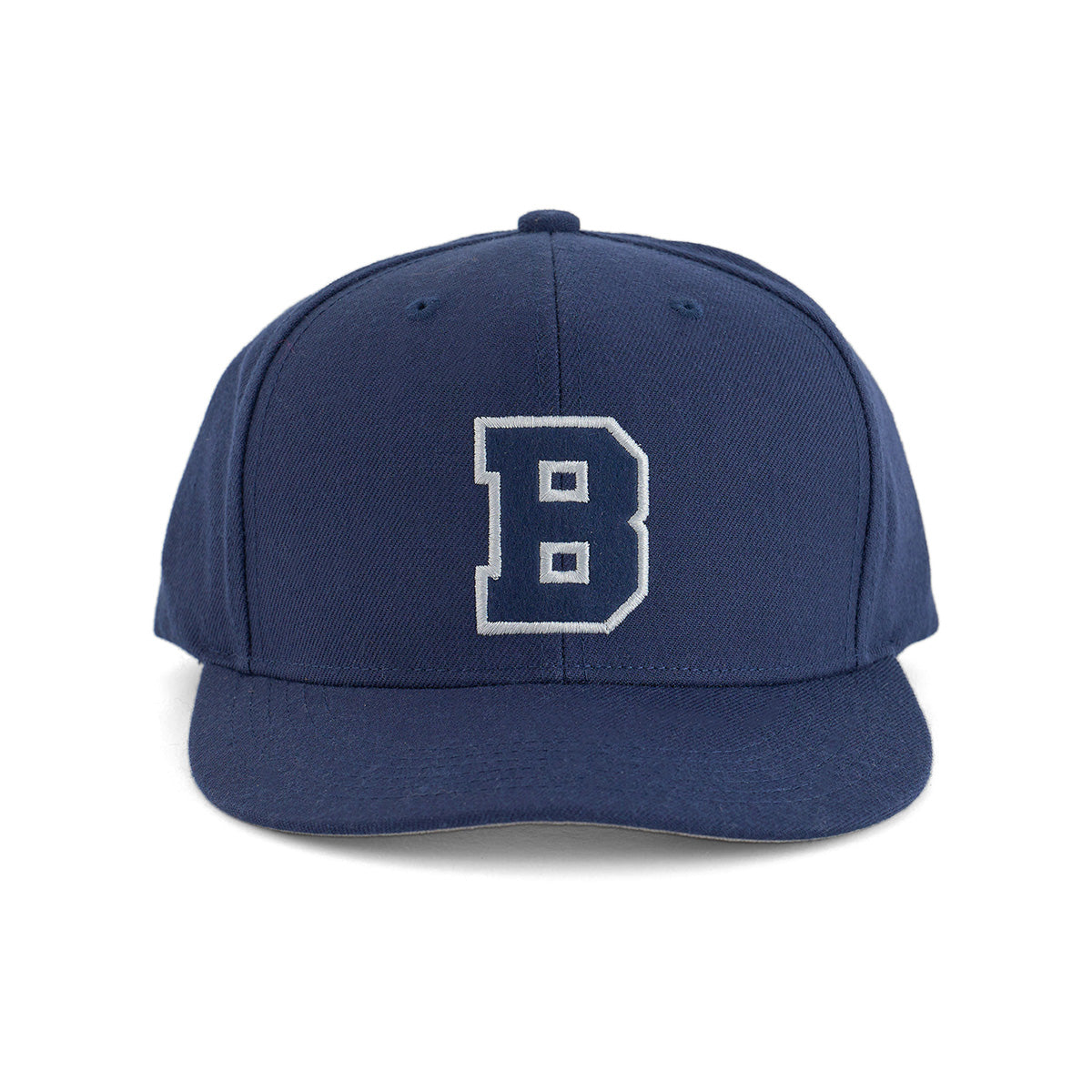 The Boeing Varsity Snapback Hat from The Boeing Store features a large white letter B outlined in black on navy blue, classic aviation style, and an adjustable snapback closure, displayed against a plain white background.
