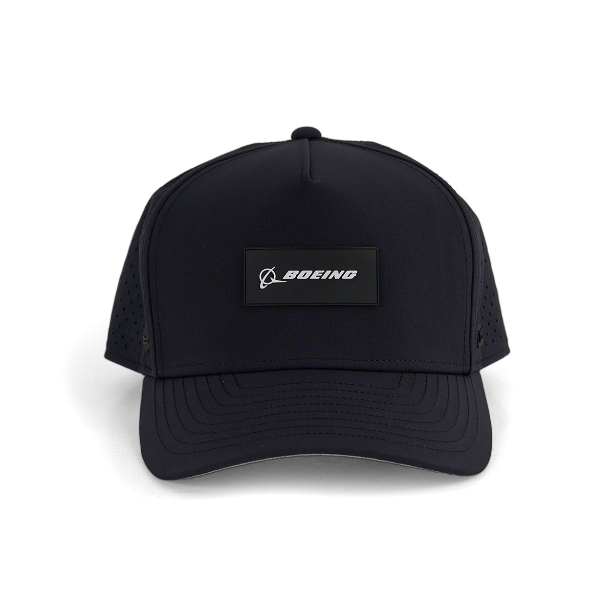 The Melin Boeing Signature Logo Odessey Hydro Hat from The Boeing Store is a black, water-repellent hat with a front rectangular patch displaying the Boeing name in white and side ventilation holes for comfort.