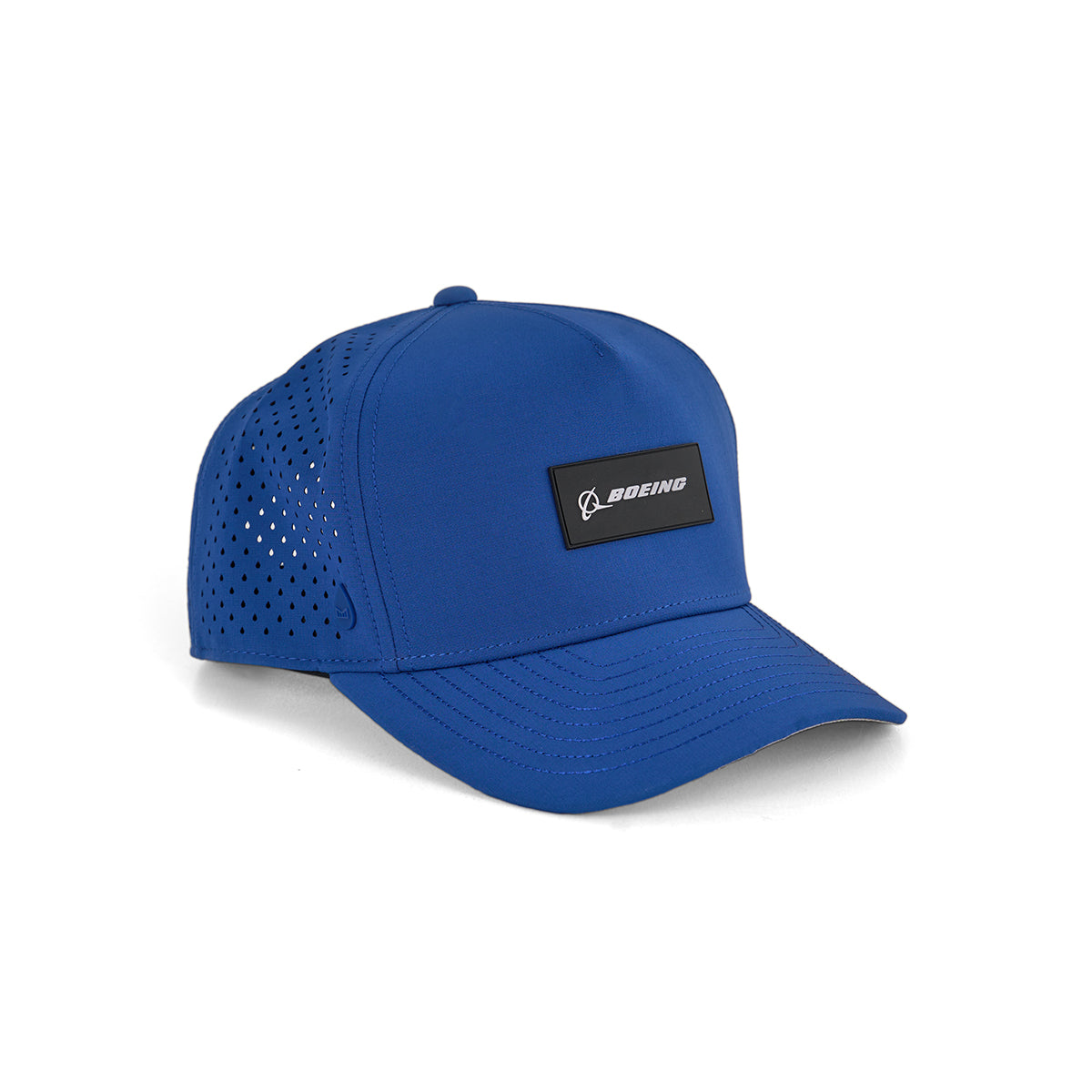 The Melin Boeing Signature Logo Odyssey Hydro Hat from The Boeing Store is a blue, water-repellent hat with a black rectangular patch and side ventilation holes for breathability, offering both style and function.