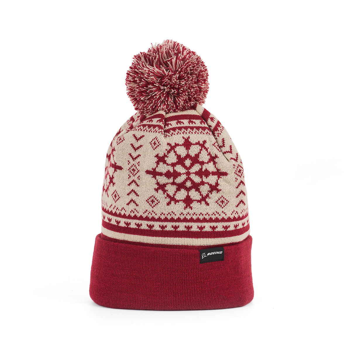 The Boeing 2025 Jet Snowflake Unisex Beanie by BOEING is a red and cream knit winter hat with a pom-pom, snowflake patterns, and a folded brim—perfect to pair with your Jet Snowflake Scarf for cozy, aviation-inspired style.