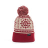 The Boeing 2025 Jet Snowflake Unisex Beanie by BOEING is a red and cream knit winter hat with a pom-pom, snowflake patterns, and a folded brim—perfect to pair with your Jet Snowflake Scarf for cozy, aviation-inspired style.