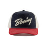 The Richardson Boeing Script Logo Trucker Hat by BOEING features a navy front, white mesh back, red brim, and an embroidered Boeing Script logo with a star above the “i.” Includes a Softsnap adjustable backstrap for custom fit.