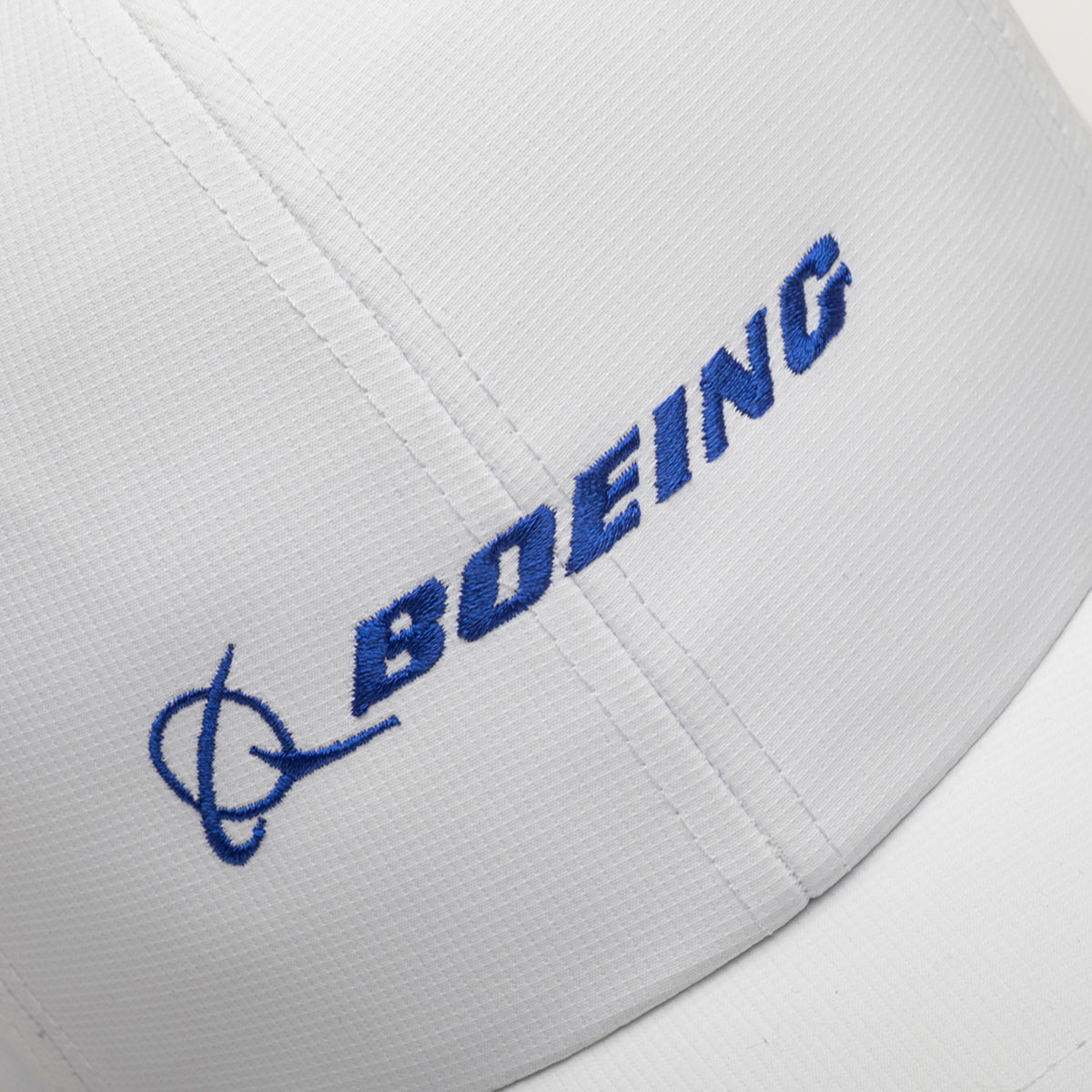 Close-up of the Boeing Signature Logo Performance Hat by BOEING, white with blue embroidered Boeing logo and text.