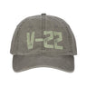 The Boeing V-22 Osprey Graphic Hat by BOEING is gray with a weathered finish and bold light green "V-22" text on the front—an ideal pick for aviation fans and Boeing supporters.