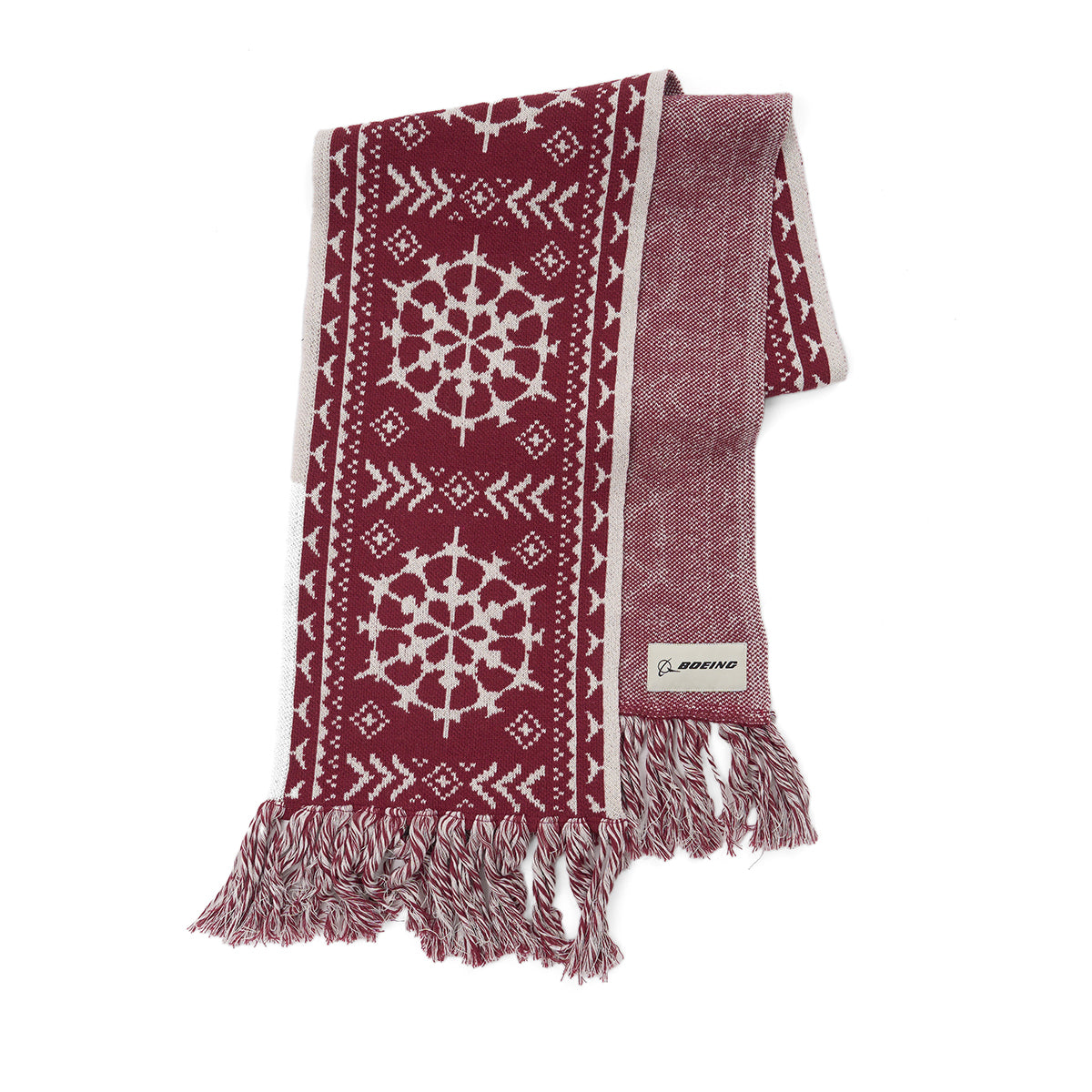 The Boeing 2025 Jet Snowflake Unisex Scarf by BOEING features a maroon and white snowflake pattern, geometric designs, fringed ends, and a Boeing logo tag—ideal for 787 Dreamliner fans.