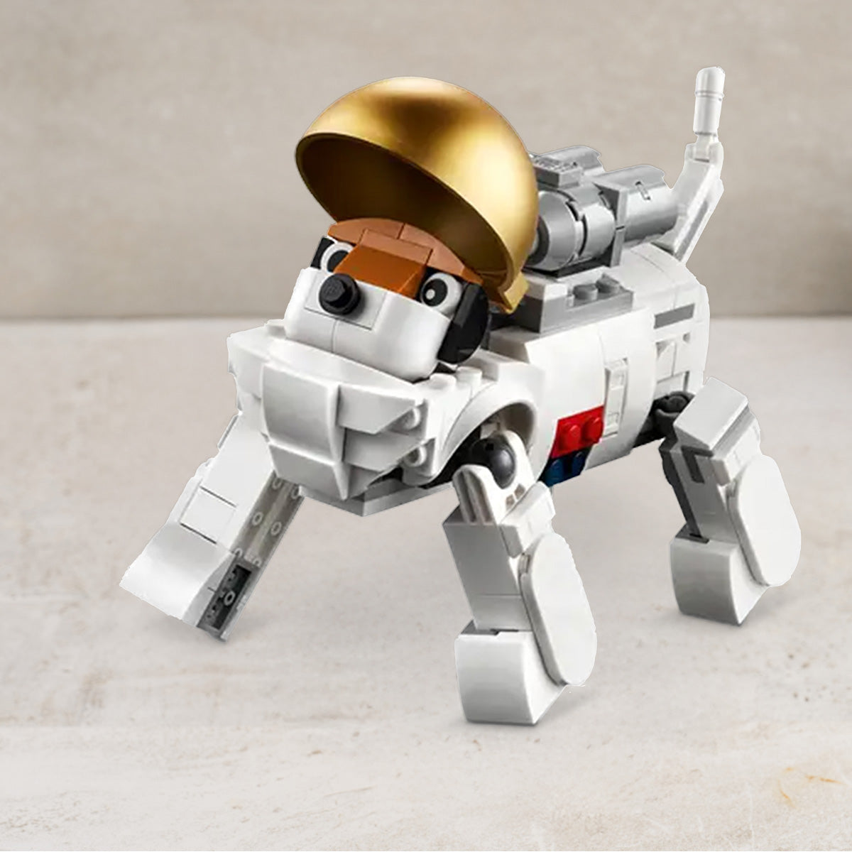 Lego space dog with a gold helmet on a light surface