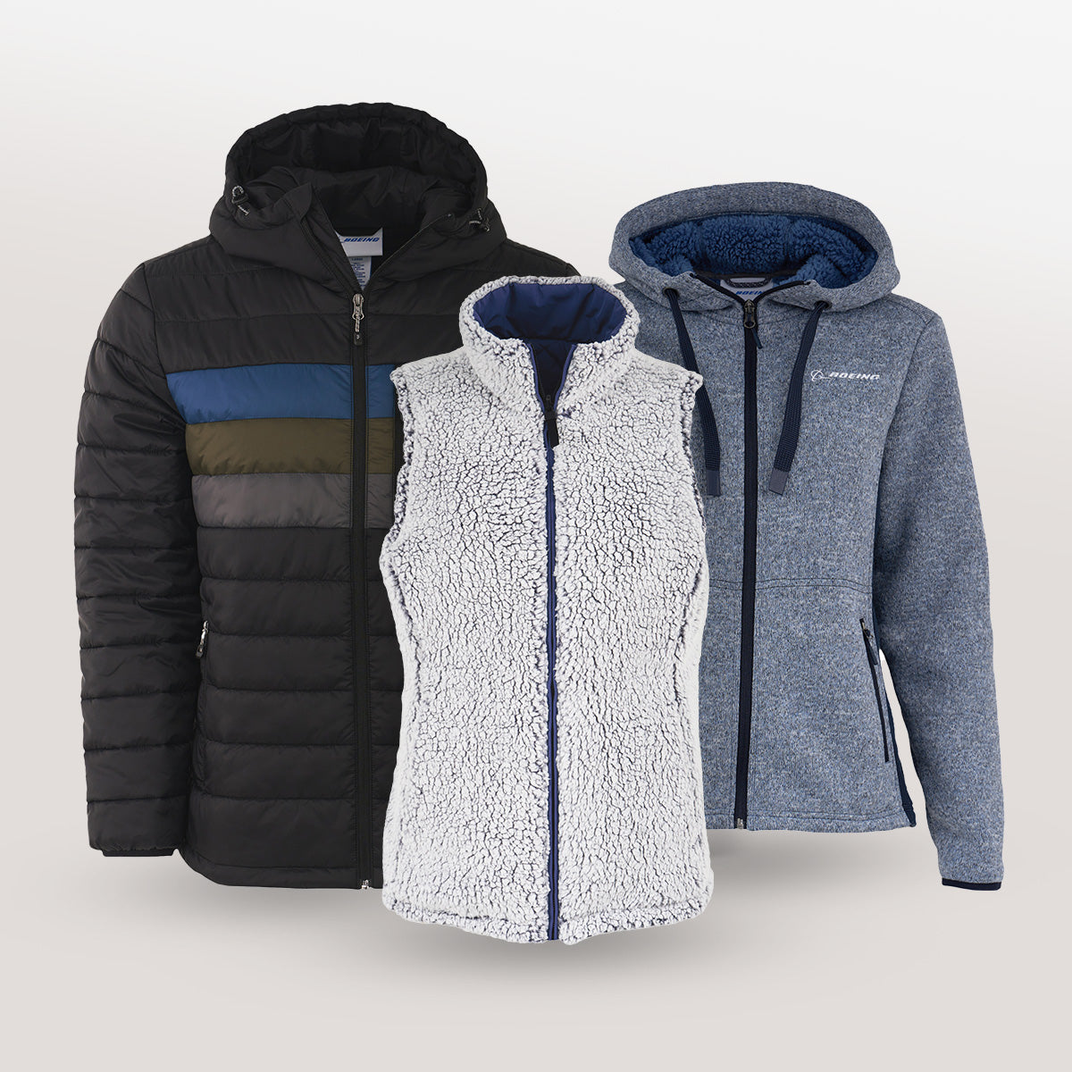 Three Boeing branded winter jackets including a black puffer, a grey fleece vest, and a blue/gray full-zip hoodie on a light gray background.
