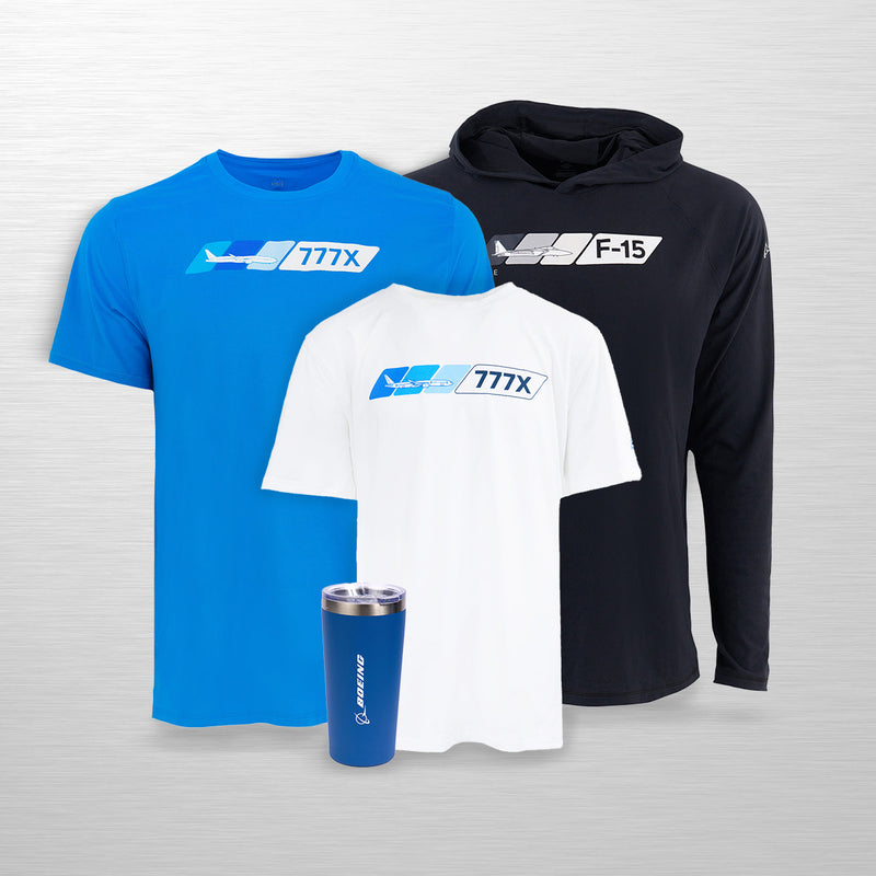 A selection of three Boeing shirts from the Velocity collection: a blue t-shirt, a white t-shirt, and a black hoodie, along with a blue tumbler, displayed against a gray background.