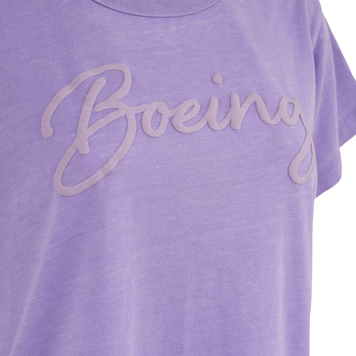Close-up of the Boeing Womens Script Logo T-Shirt by BOEING, showcasing a lavender design with Boeing in large cursive letters across the chest for a stylish, casual look.