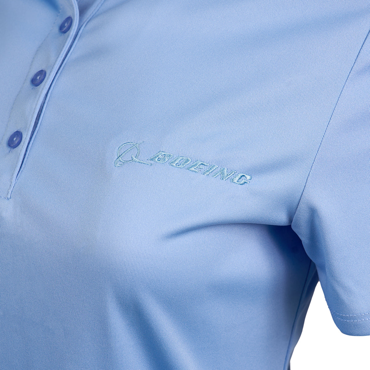 Close-up of the Callaway Boeing Womens Tournament Polo in light blue, featuring a subtle embroidered Boeing logo on the chest. This polo includes Opti-Dri technology for moisture-wicking and a four-button collar, offering comfort and style both on and off the course.