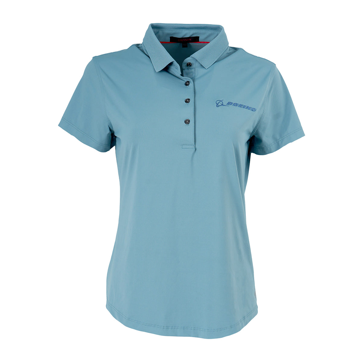 The Greyson Boeing Women’s Scarlett Crowley Polo by BOEING is a light blue, short-sleeve athletic fit polo with buttons and a knit cutaway collar, featuring the Boeing logo embroidered on the left chest. Displayed on a plain white background.