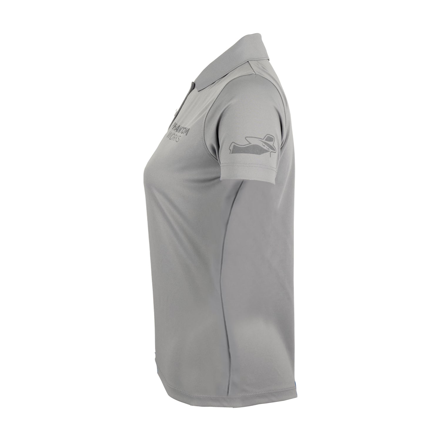 The Boeing Phantom Works 2025 Women’s Performance Polo by BOEING is shown in gray with short sleeves, a collar, and a partial sleeve logo visible from the left side. Minimal detail appears on the chest area.
