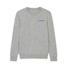 The Boeing Signature Women’s Cashmere Sweater by BOEING is a light gray luxury cashmere crewneck with long sleeves and features a small blue Boeing logo on the upper left chest.