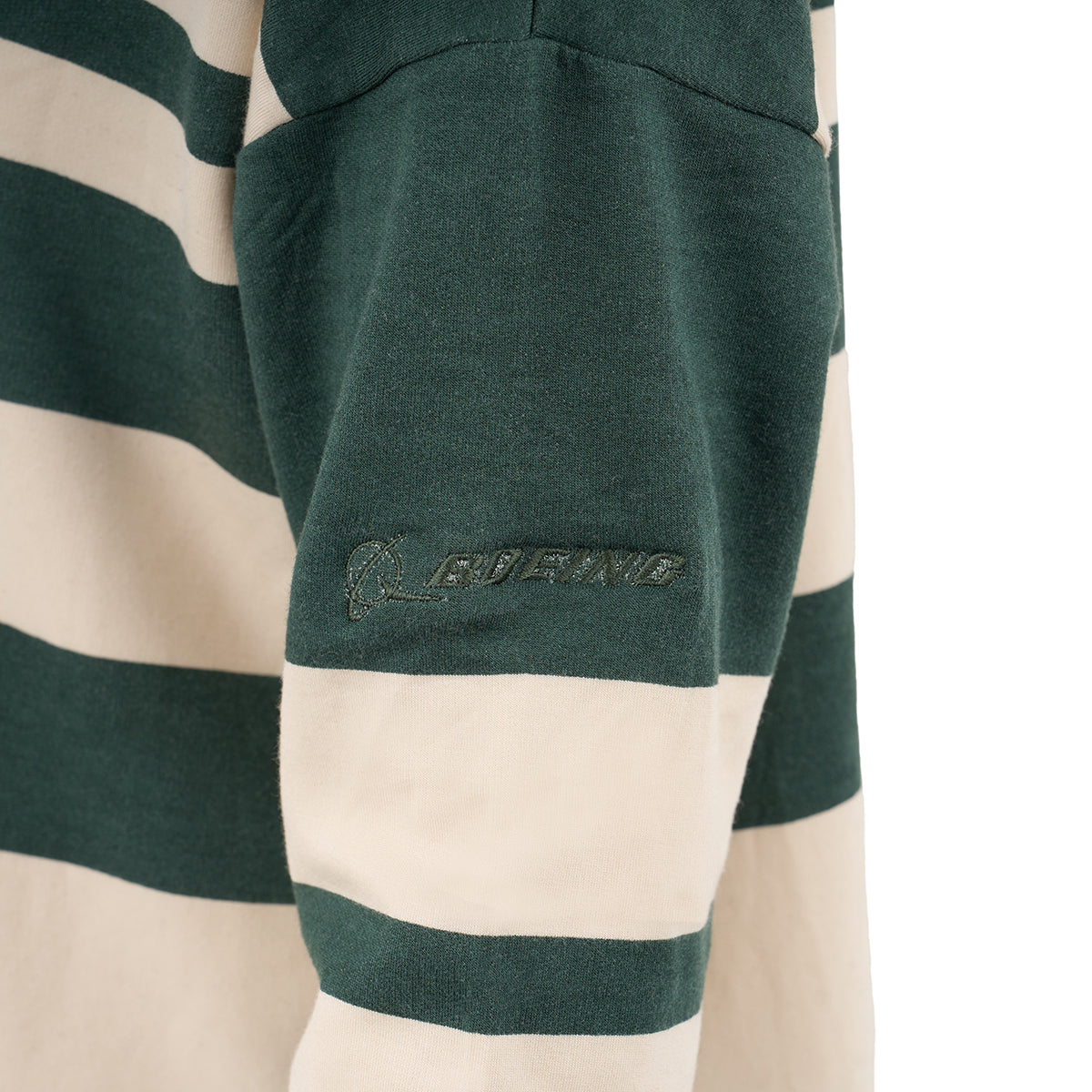 A close-up of the Glyder Boeing Women’s Lounge Long-Sleeve by BOEING shows green and cream stripes, the word GUENG, a small graphic, and soft ISOSOF fabric.