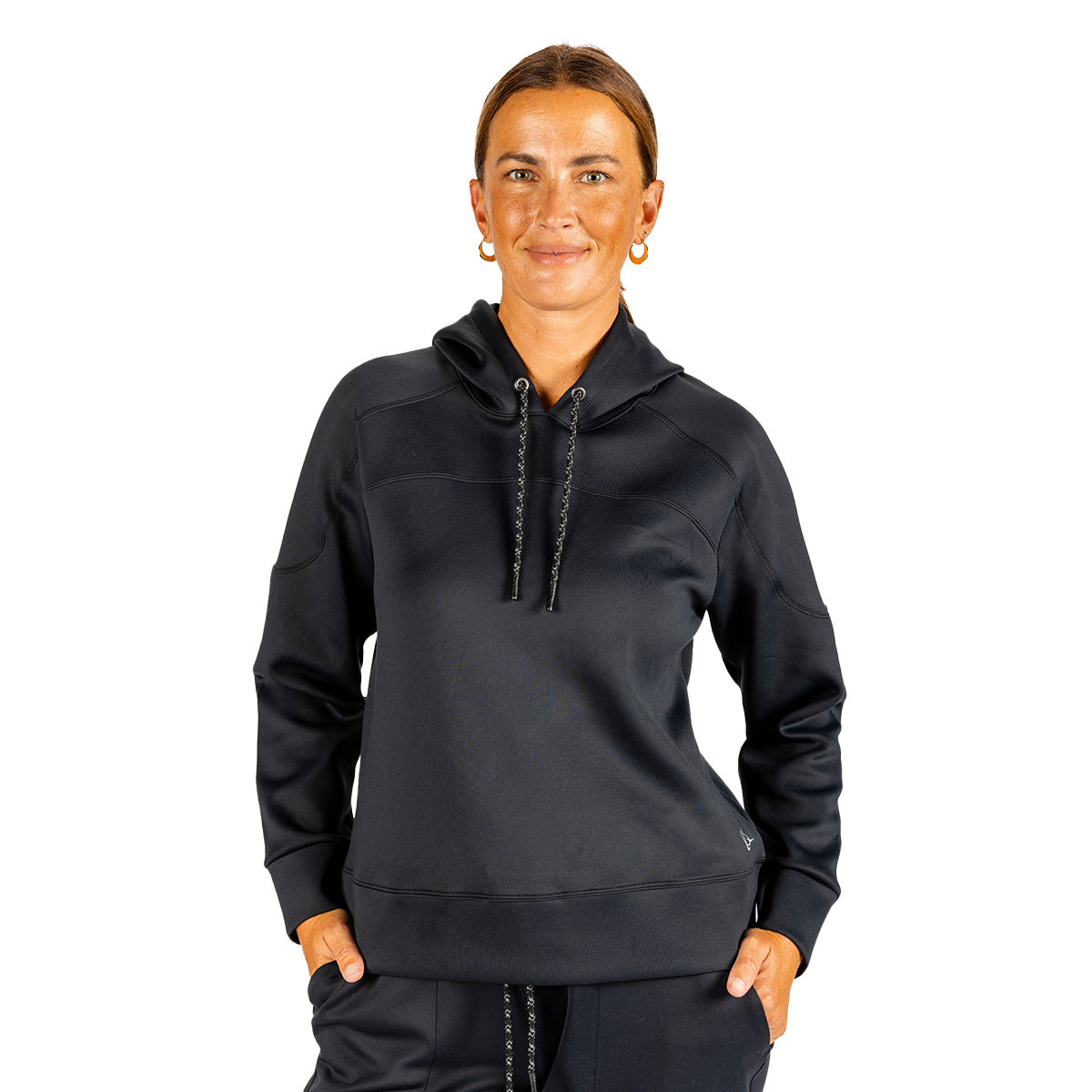 A woman wearing a black, long-sleeved Boeing Women’s Sueded Lush Hoodie featuring a hood and a front kangaroo pocket.