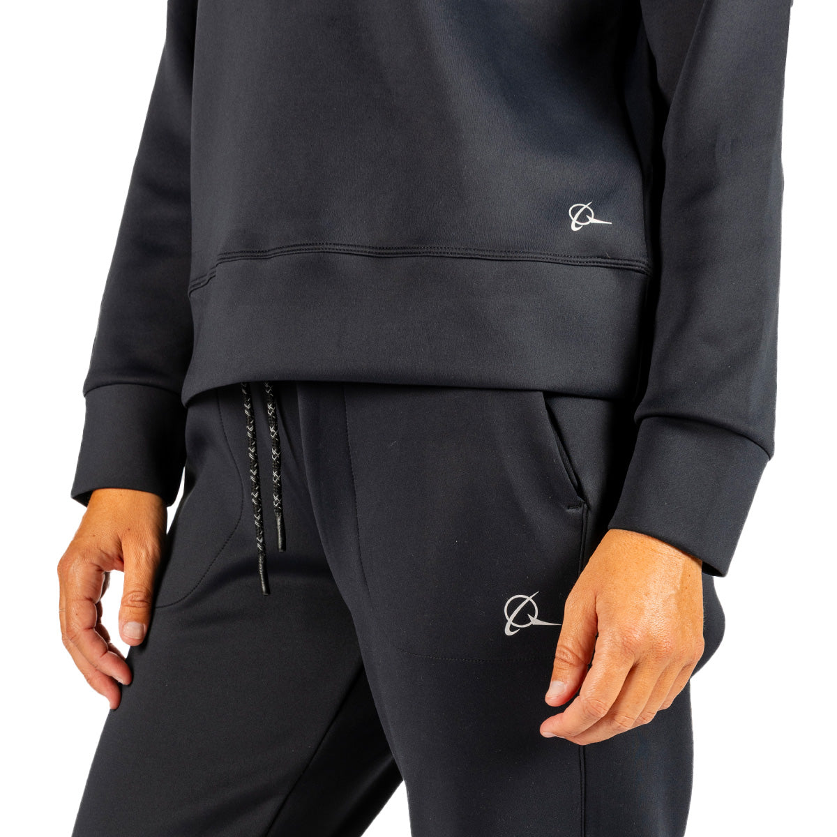 Person wearing a Boeing Women’s Sueded Lush Hoodie and matching joggers, both featuring a small white orbital logo.