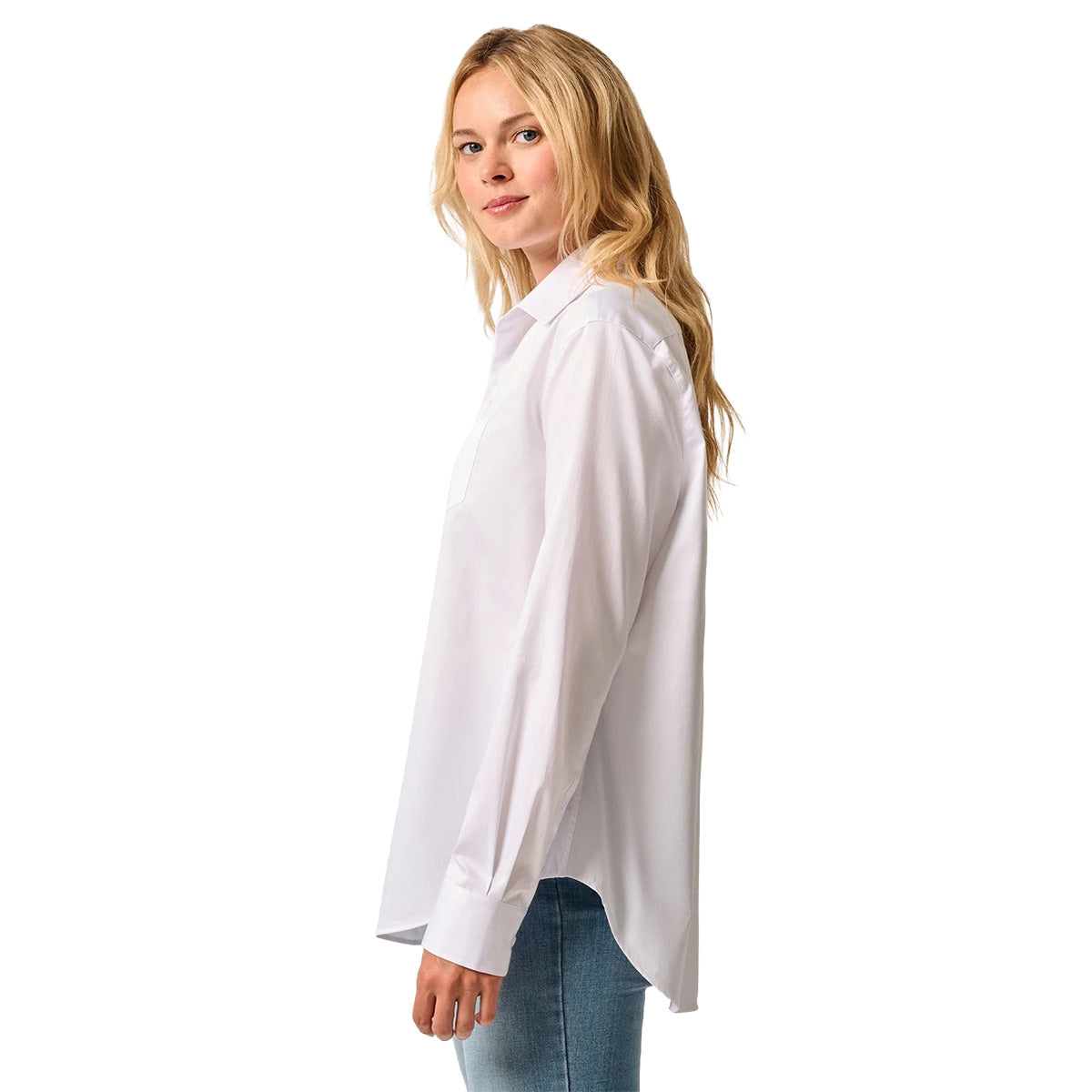 A woman with long blonde hair wears the BOEING johnnie-O Women's Jess Button-Down Shirt paired with blue jeans, standing sideways and looking at the camera against a plain white background.