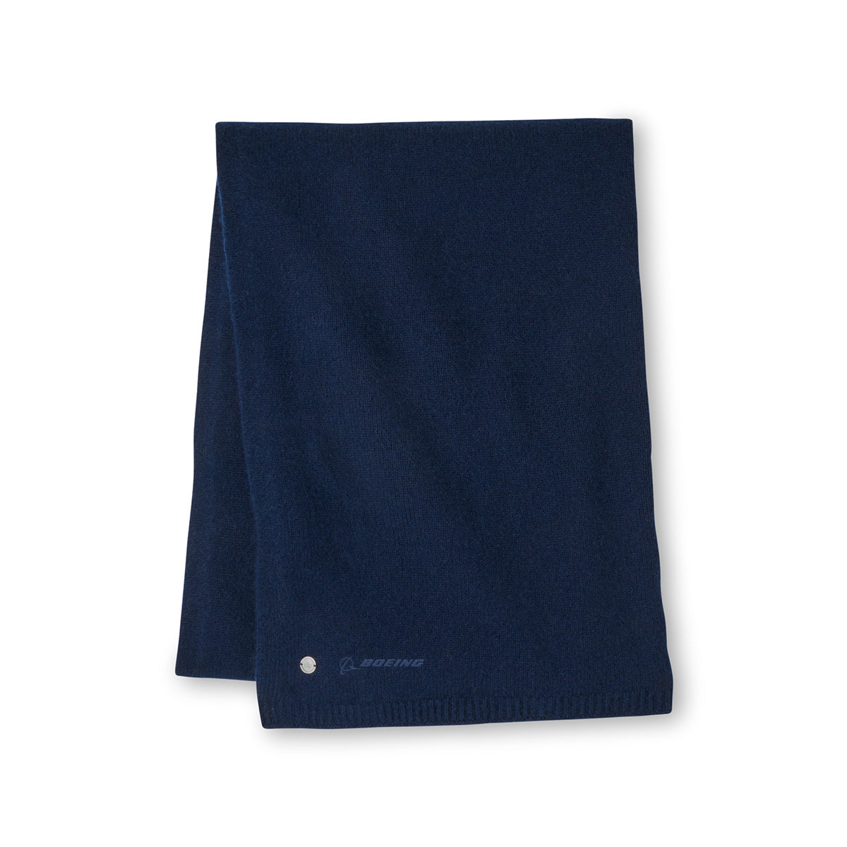 The Peter Millar Boeing Cashmere Wrap by Boeing is a dark blue cashmere scarf featuring a small silver circular emblem and the Boeing logo near one edge, stylishly displayed on a plain white background.