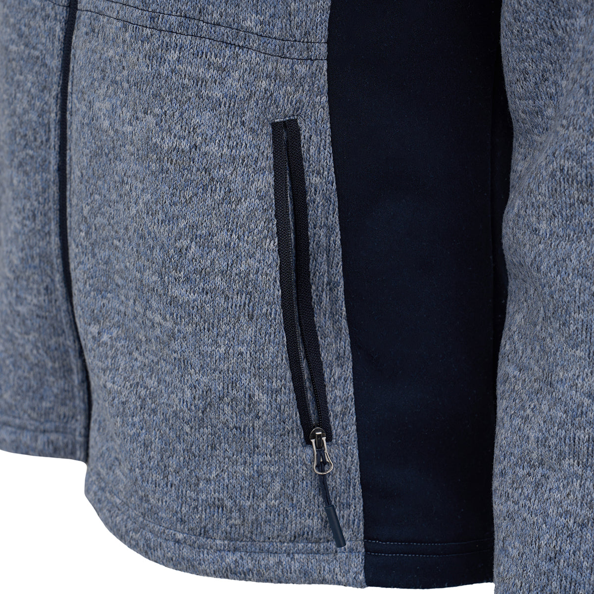 Close-up of the Boeing Women's Mountain Fleece Jacket by BOEING, in gray and black, featuring a vertical zippered side pocket, textured fabric, visible stitching, and flexible power stretch panels for added comfort.