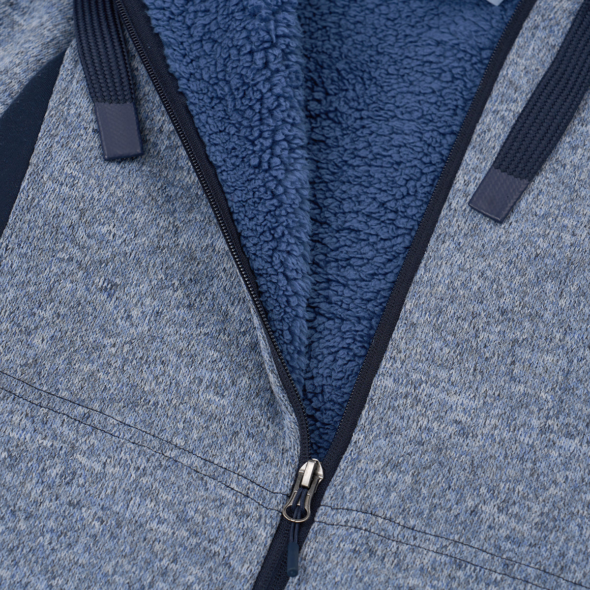 Close-up of the Boeing Women's Mountain Fleece Jacket by BOEING in blue, showing power stretch panels, soft textured fleece lining, dark blue drawstrings, and a partially open zipper revealing the plush interior.