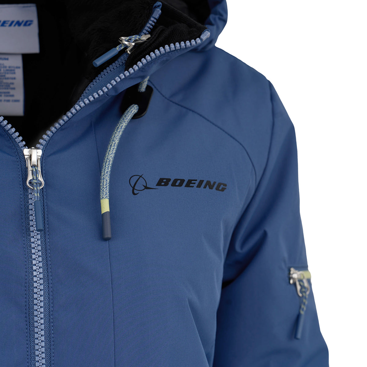 A close-up of the Boeing Women's 3-in-1 Systems Jacket by BOEING, in blue, showcases wind resistance, the Boeing logo on the chest, and features visible zippers and drawstrings.