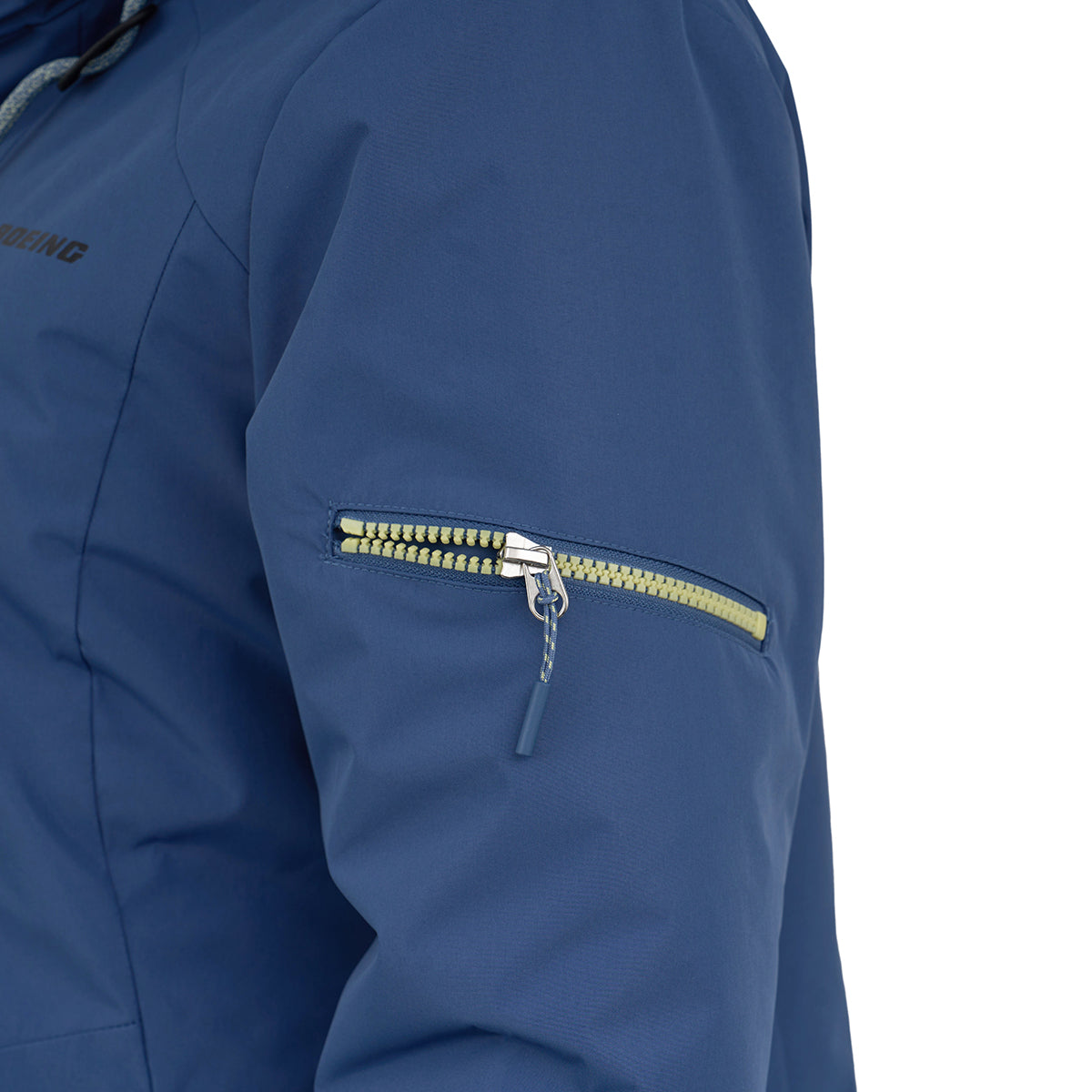 Close-up of the Boeing Women's 3-in-1 Systems Jacket by BOEING shows a blue, wind-resistant sleeve with a yellow zipper pocket, smooth texture, and visible seam lines.