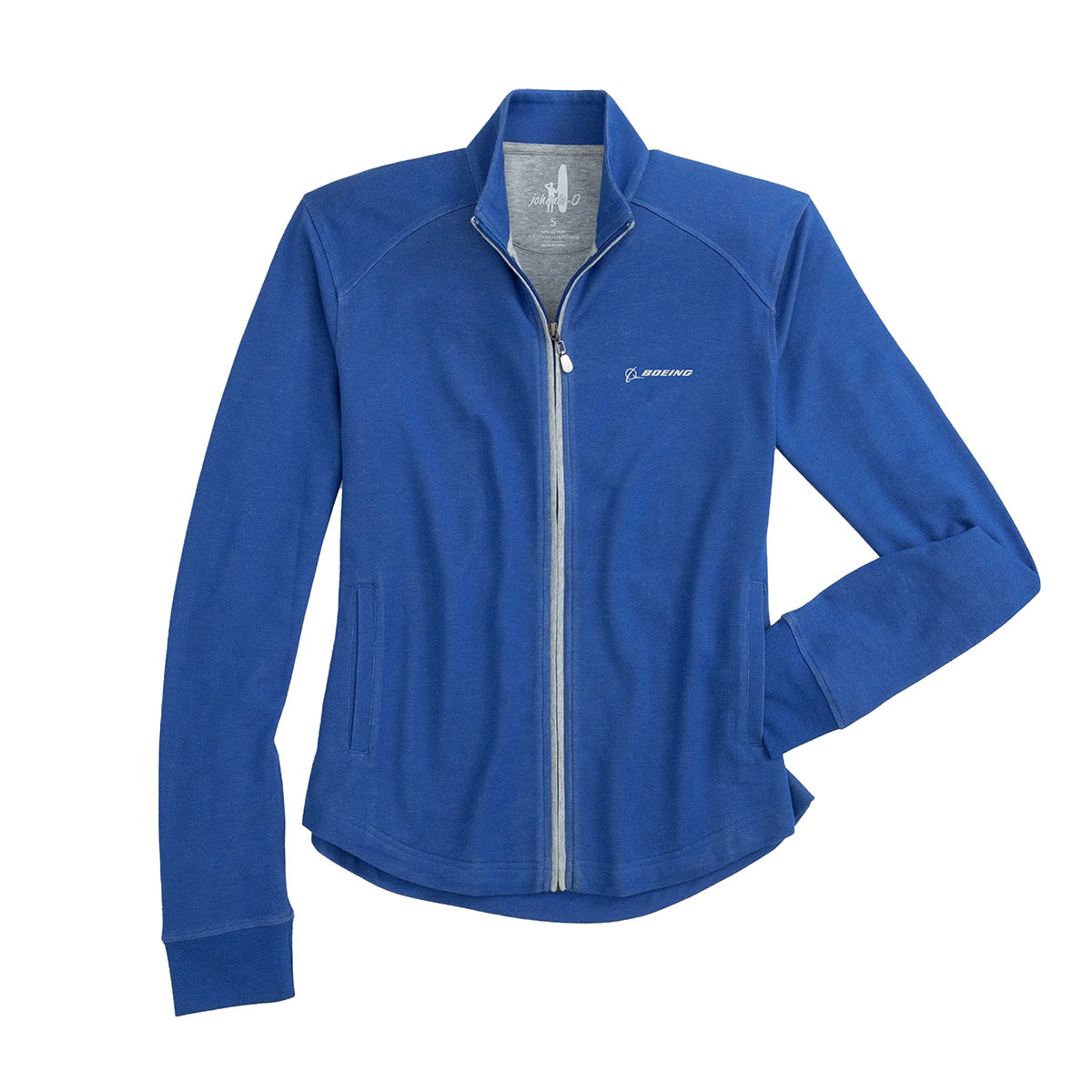 The johnnie-O Boeing Women’s Tomi Full-Zip Jacket by BOEING, shown in blue with long sleeves, stand-up collar, light gray zipper and inner lining, and two side pockets, features the Boeing logo for a sleek touch. Displayed on a white background.