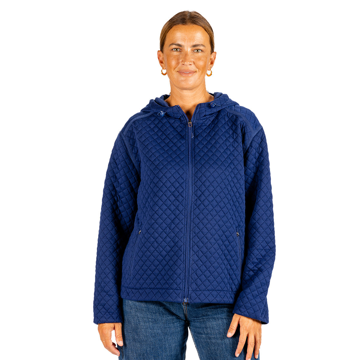 A woman wearing a dark blue, long-sleeved, hooded Boeing Women’s Hooded Quilted Jacket.