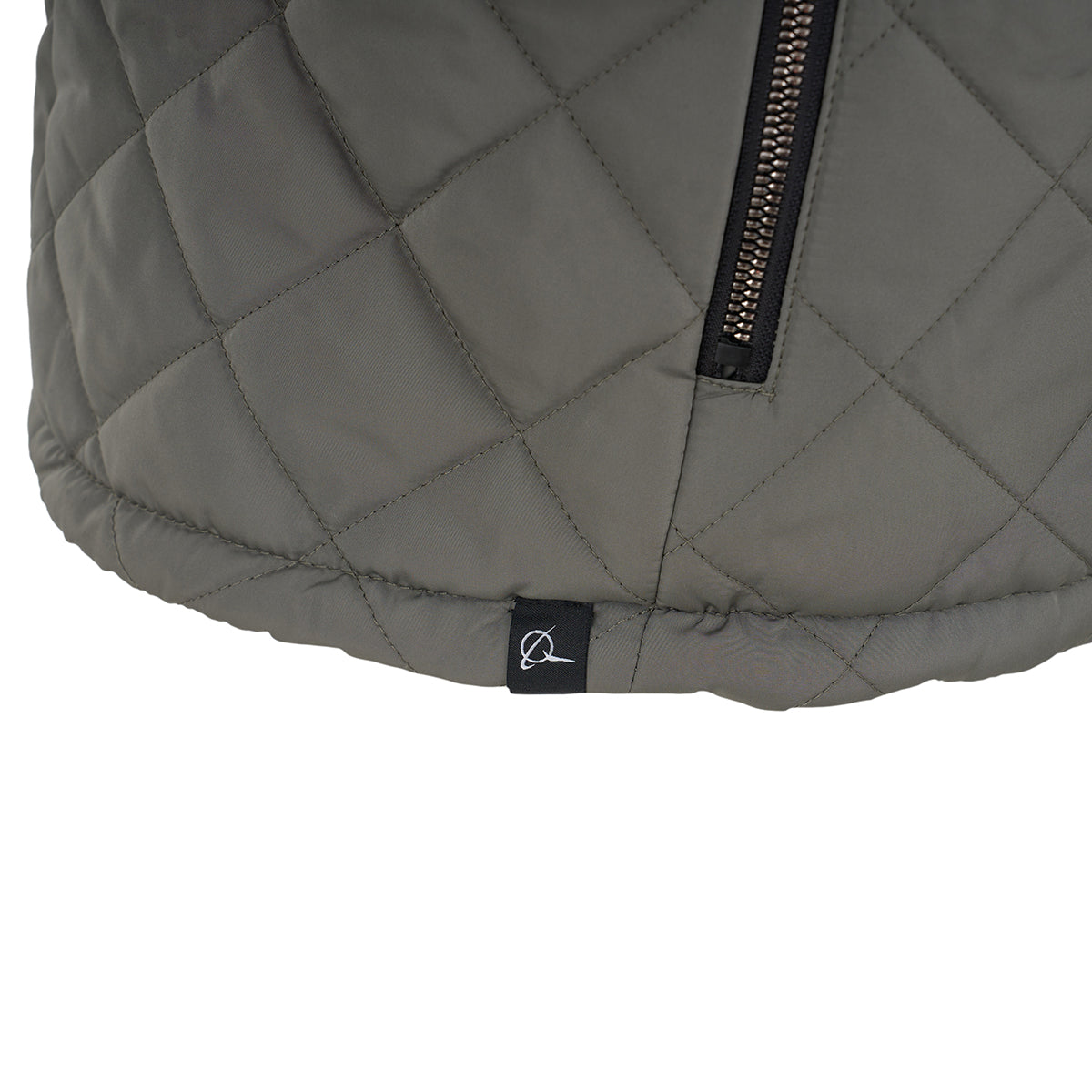 Close-up of the Boeing Women's Stratus Lite Reversible Vest by BOEING, featuring quilted gray fabric, a visible zipper, and a small black tag with a white minimalist logo near the hem, highlighting its wind-resistant design.