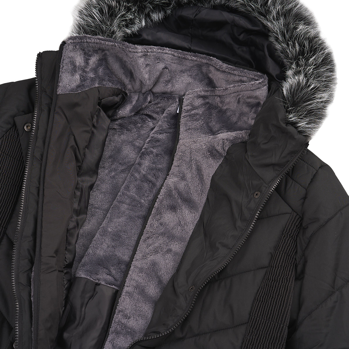 A close-up of the BOEING Women's Quilted Butterpile Jacket showcases its wind-resistant black exterior, gray faux fur-trimmed hood, and partially unzipped design revealing the soft, cozy interior.