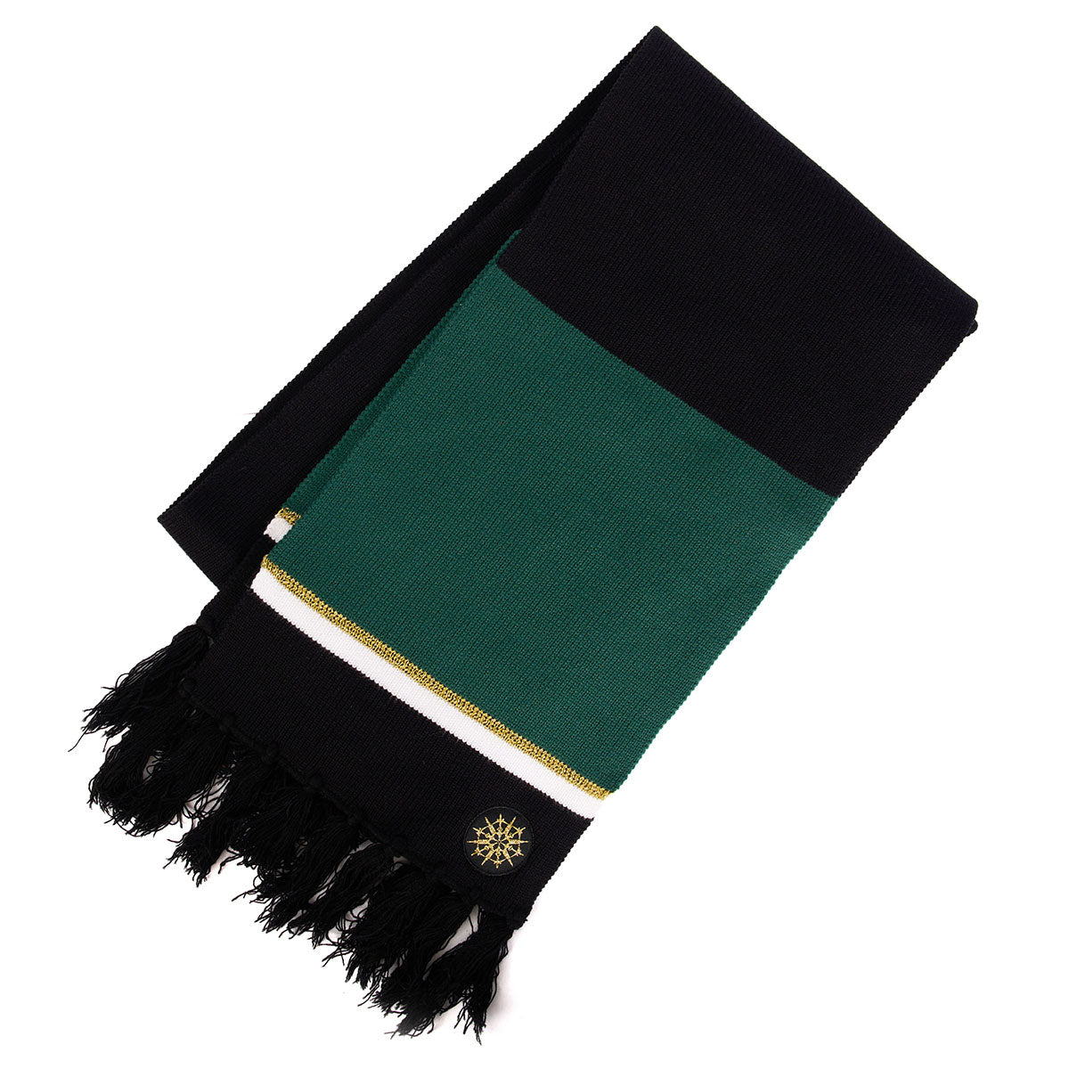 The Boeing 2023 Jet Snowflake Scarf features black, green, and white stripes, black fringes on one end, and a small embroidered gold and black circular patch near the fringe—a Boeing exclusive accessory.