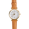 The Boeing Symbol Womens Leather Solar Watch by Boeing showcases a round, gold-toned stainless steel case, a white face with gold hour markers, and SOLAR above 6 oclock. Its design is enhanced by a light brown genuine leather strap.
