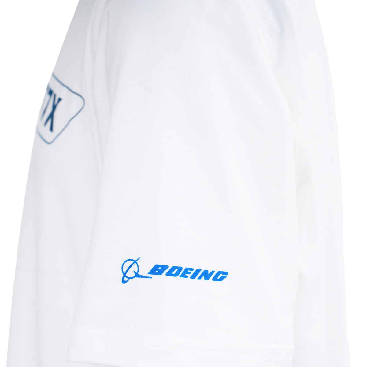 Close-up of the Boeing 777X Velocity Kids’ Tech Stretch T-Shirt by BOEING, showing its smooth white fabric, blue Boeing logo on the sleeve, and a partial blue Boeing 777X graphic on the chest.