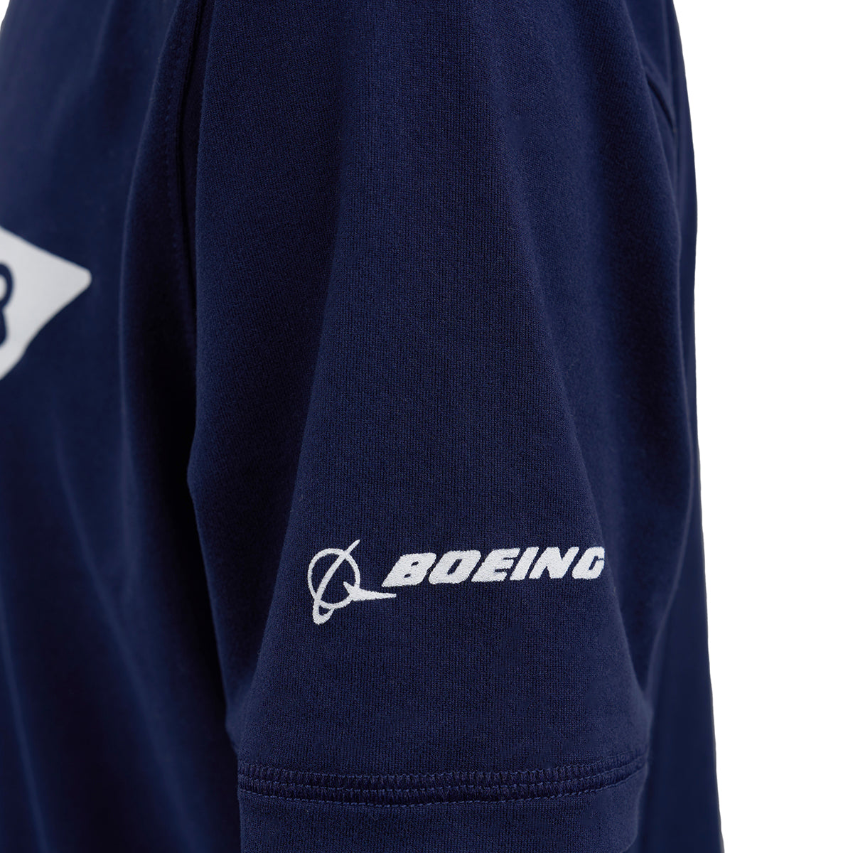 Close-up of the Boeing F/A-18 Super Hornet Velocity Kids’ Tech Stretch T-Shirt in navy blue, featuring a moisture-wicking sleeve with the white BOEING logo and name embroidered on it.