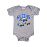 Full product image of the onesie in heather grey color. Boeing varsity logo across the chess with 3 pudgy planes below the text.