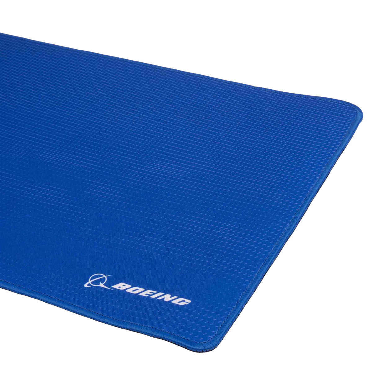 A close-up view of the Boeing Signature Royal Desk Pad from BOEING, showcasing its textured blue surface with a subtle royal cloud design and the BOEING logo printed in white in the bottom right corner.